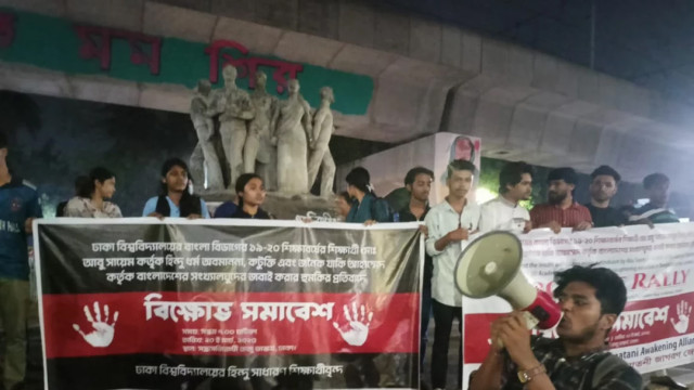 Hindu students of Dhaka University stage a demonstration at Raju Memorial Sculpture, demanding the permanent expulsion and legal punishment of a student for making derogatory comments about Hinduism on social media, on Thursday, March 20, 2025.