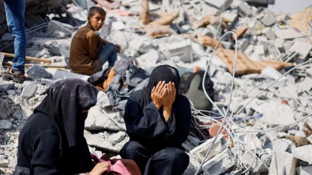 File photo: Palestinian sisters Samar and Sahar react as they search for their missing mother Amira Al-Breim at the rubble of a house hit in an Israeli strike, in Khan Younis in the southern Gaza Strip