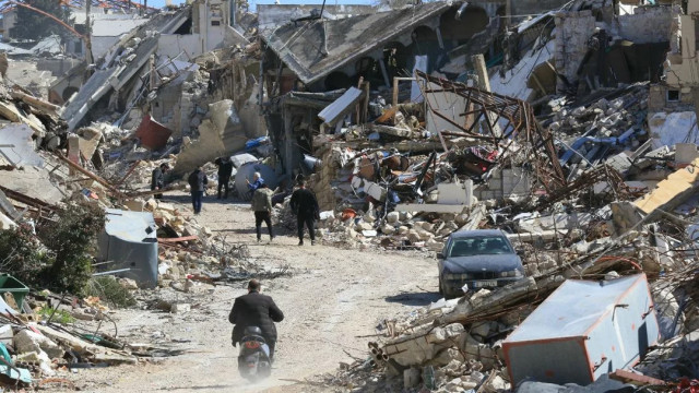 File image: People inspect their destroyed homes in the southern Lebanese village of Adaisseh on February 18, 2025. Photo: AFP