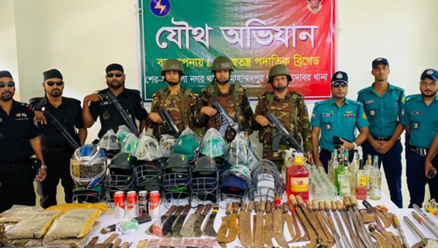 The joint forces comprising RAB, police and army personnel conducted the drive in Geneva Camp and seized arms and drugs.