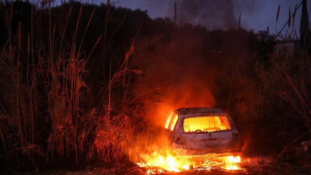 A car burns following clashes between Syria`s new authorities and supporters of deposed president Bashar al-Assad near the town of Jableh in the coastal province of Latakia on March 10, 2025. Photo: AFP