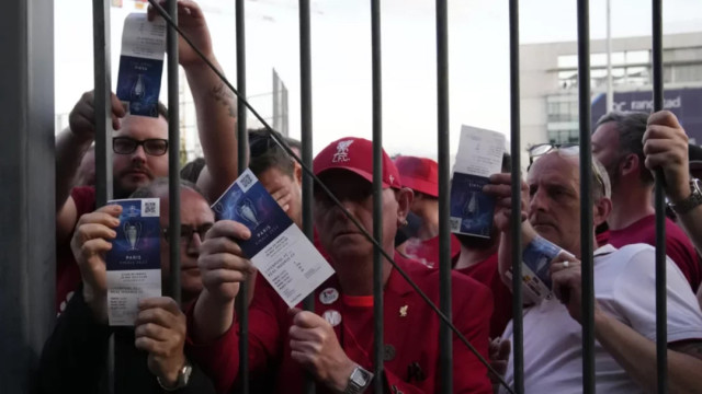 Liverpool fans show the tickets prior to their 2022 Champions League final against Real Madrid in Paris