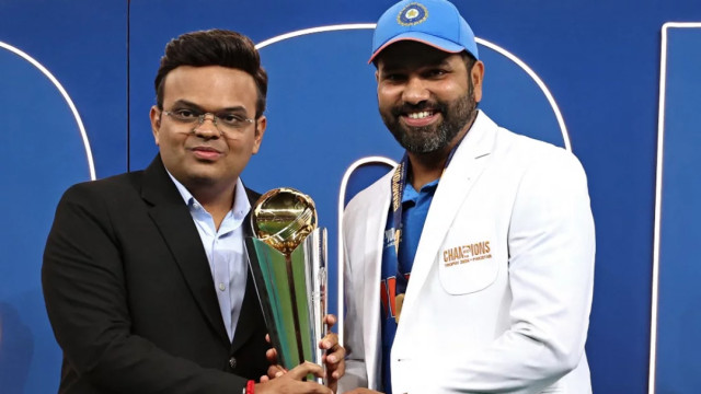 International Cricket Council chairman Jay Shah presents the Champions Trophy to India captain Rohit Sharma at the end of Sunday’s final against New Zealand in Dubai Photo: AFP