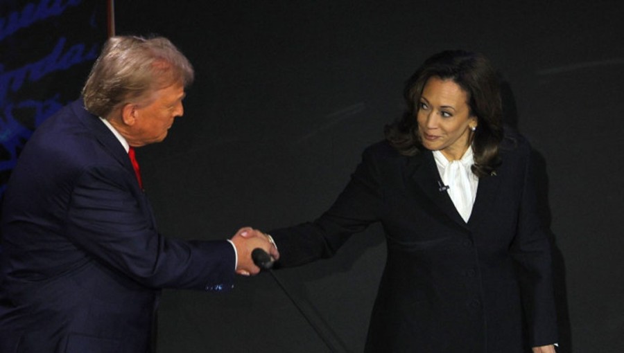 Republican presidential nominee, former US President Donald Trump and Democratic presidential nominee, US Vice President Kamala Harris shake hands as they attend a presidential debate hosted by ABC in Philadelphia, Pennsylvania, US, September 10, 2024.