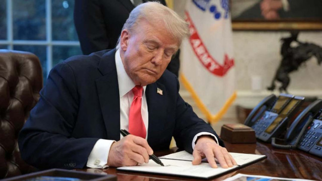 File image: US President Donald Trump signs an executive order in the Oval Office at the White House in Washington, DC on February 25, 2025. Photo: AFP