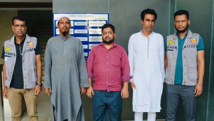 The image shows three members of a gang along with two DB officials at DB office in Dhaka on Saturday.