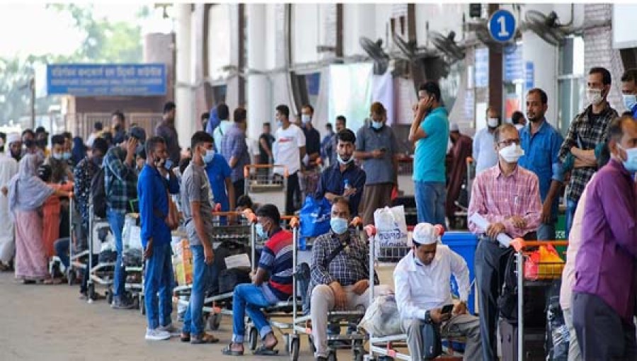 The undated image shows expatriate workers waiting outside Hazrat Shahjalal International Airport in Dhaka.