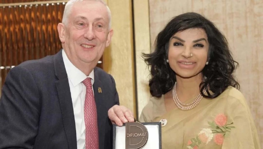 The image shows Bangladesh High Commissioner to the UK Saida Muna Tasneem receiving the ‘Diplomat of the Year Award 2024’ from the Speaker of the British Parliament Sir Lindsay Hoyle in London.
