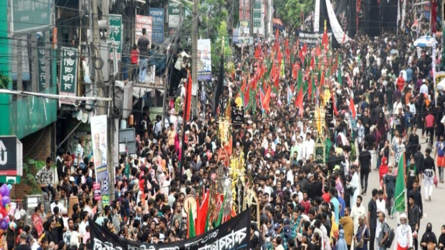 Thousands of devotees march from historic Hosni Dalan to Dhanmondi, honoring the martyrdom of Imam Hussain (RA) with traditional mourning rituals.