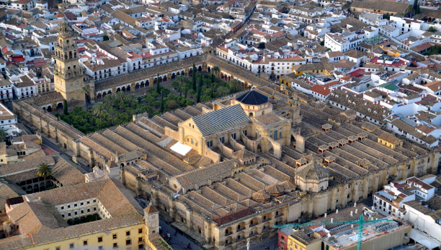 The Great Mosque of Cordoba exemplifies the rich Islamic legacy and Spain's diverse history, symbolizing a commitment to enlightenment and unity amidst global divisions.