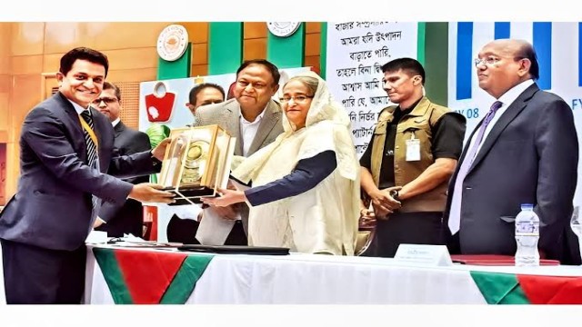 A K Azad receiving National Export Trophy (Gold) on behalf of Rifat Garments (a sister concern of Ha-meem Group) on Sunday in the city from Prime Minister Sheikh Hasina