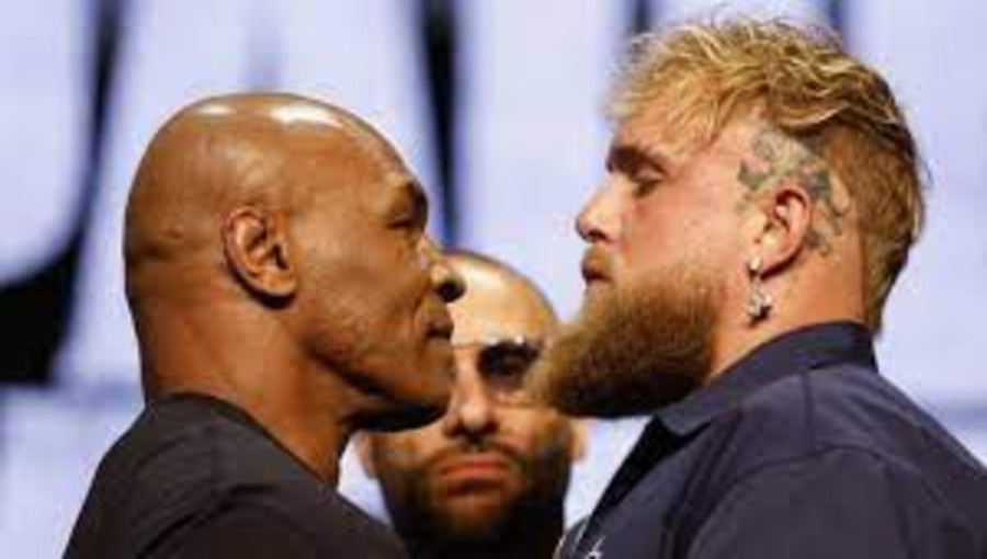 Mike Tyson Reacts to Jake Paul’s Fight Offer – Former heavyweight champion Mike Tyson discusses Jake Paul’s $5 million offer for their upcoming fight on November 15, suggesting instead that he deserves $20 million. Tyson remains confident in his ability to secure a win against the social media star, indicating he is ready for the challenge ahead. (Photo: Collected)