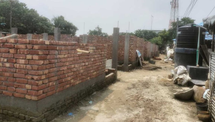 A nearly one crore BDT Ashrayan project in Poba, Rajshahi, is being managed by UNO Abu Saleh Mohammad Hasnat's cousin, Rajib Ronak, raising concerns over alleged substandard work and bribery involving construction materials.