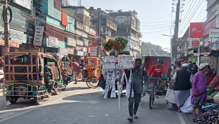 Victory Day Spirit: Streets of Netrokona Adorned with Red-Green Flags