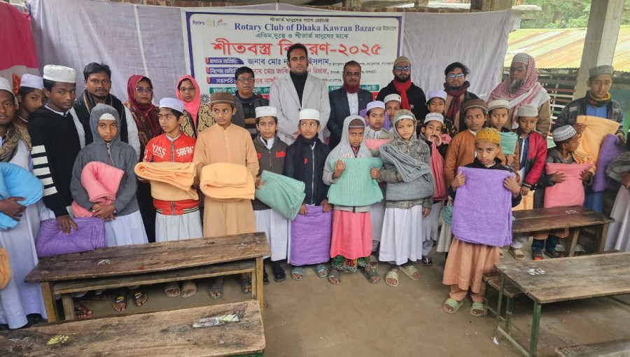 Winter clothes being distributed to 100 orphans and underprivileged individuals in Morelganj, Bagerhat, organized by the Rotary Club of Kawran Bazar and the RCC Committee.