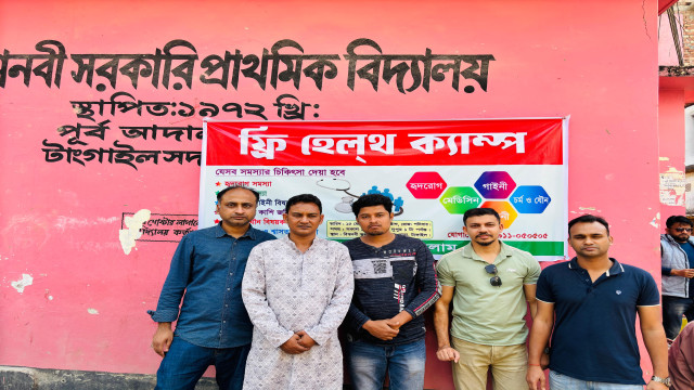 Doctors providing free medical consultations to local residents at a health camp in Tangail.