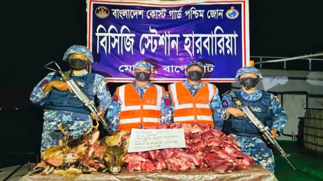 Coast Guard personnel from Mongla inspect seized deer meat and body parts during operations against poachers in the Sundarbans.