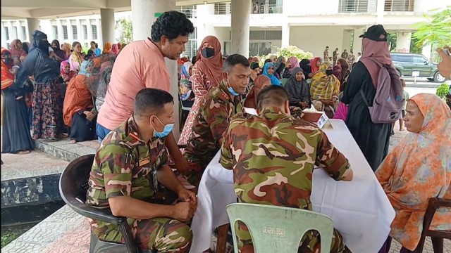 Military medical personnel provide free consultations to local residents during a day-long healthcare camp organized by the Bangladesh Army in Kalihati, Tangail on July 12. (Photo: V7N)