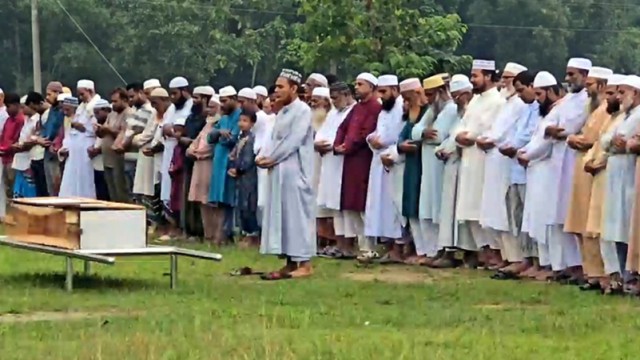 Mourners gather solemnly at the Janaza prayer for the two Tangail students, Tanvir Ahmed and Mehnaz Afrin Humaira, victims of the Milestone School plane crash in Dhaka.