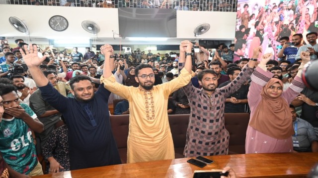 Newly elected JUCSU VP Abdur Rashid Jitu and GS Mazharul Islam celebrate their victory with supporters on the Jahangirnagar University campus.