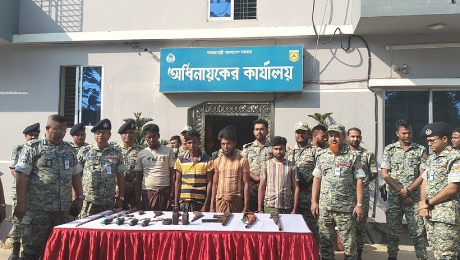 APBN officers display the seized grenades, walkie-talkies, weapons, and bullets recovered from the armed arrested ARSA terrorists. Photo; Voice7 News