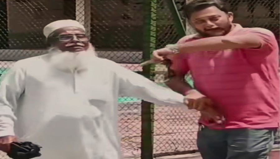 Former district freedom fighter Abdur Rashid is seen being assaulted by Iftikhar Alam Shaon Molla in front of the Barguna District Commissioner's office. The incident was captured in a viral video.