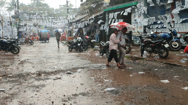 The first rain of the season in Chatmohar, Pabna, on February 22, bringing relief from the heat but causing some disruptions for locals.