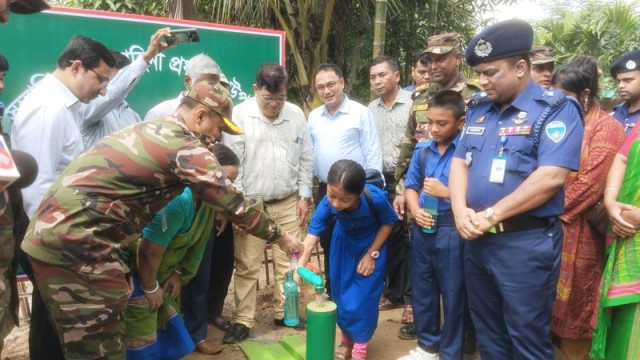 Villagers of Rejamoni Para collect safe drinking water from a newly installed solar-powered system set up by the Bangladesh Army in Panchhari upazila.