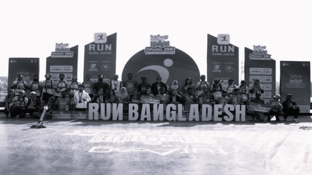 Winners celebrate after crossing the finish line at Hatirjheel, Dhaka.