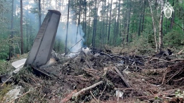 Burning wreckage of the nearly 50‑year‑old Antonov An‑24 flight operated by Angara Airlines lies in a remote forested hillside near Tynda, Russia, after it crashed during a second landing attempt.