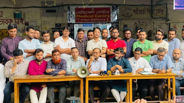 Teachers’ Association of Jagannath University holds a press conference in front of the Language Martyr Rafique Building on Wednesday, demanding justice for murdered student Zobayed Hossain and rejecting the police claim of a “love triangle” motive.