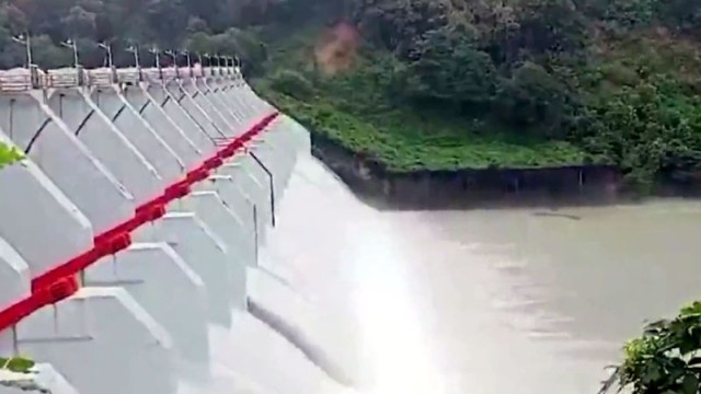 Kaptai Hydroelectric Power Station officials open 16 sluice gates by 1.5 feet to release 61,000 cusecs of water from Kaptai Lake amid rising water levels, August 6, Rangamati.
