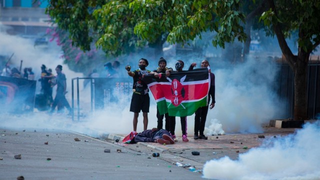 Protesters clash with police during anti-government demonstrations in Nairobi, Kenya, as tensions escalate over new tax reforms. At least 16 people were killed amid a violent crackdown.