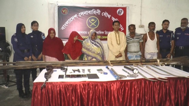 Joint forces display recovered firearms and ammunition after arresting six suspects, including three women, during a raid in Ghunsi village of Madaripur’s Sadar Upazila.