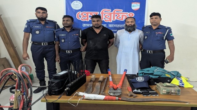 Police officials at a press conference in Bagerhat, announcing the arrest of two gang members involved in a robbery while disguised in police uniforms.