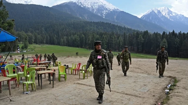 File image: Security personnel inspect the site in the aftermath of an attack as food stall chairs lie empty in Pahalgam, about 90km from Srinagar on April 23, 2025. Photo: AFP
