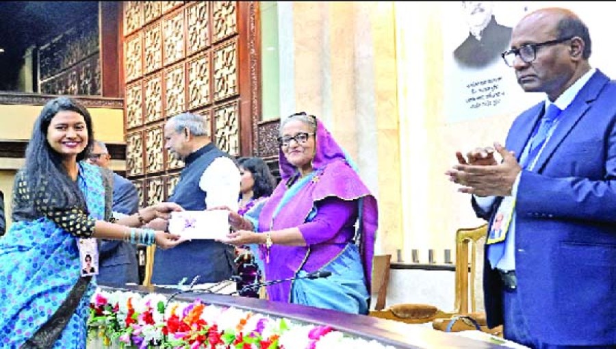 Prime Minister Sheikh Hasina handed over donation cheques to researchers of different organizations .