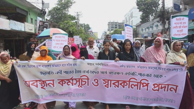 “Residents of Ichamati River in Pabna march to the district commissioner’s office, demanding compensation and protection of their legally owned land.”