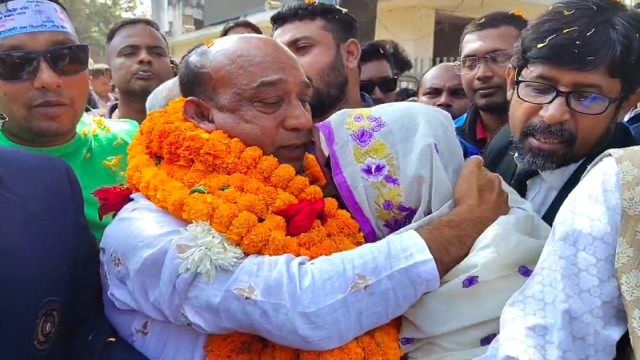 "Rezaul Karim Shaheen emerges from Pabna Jail, breaking down in tears as he reunites with his family after many years."