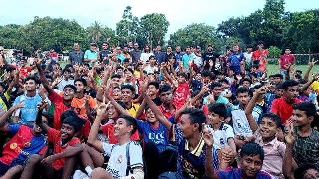 Young footballers celebrate their selection alongside guests and coaches at the Baluchar playing field in Chatmohar, Pabna, on Wednesday afternoon.
