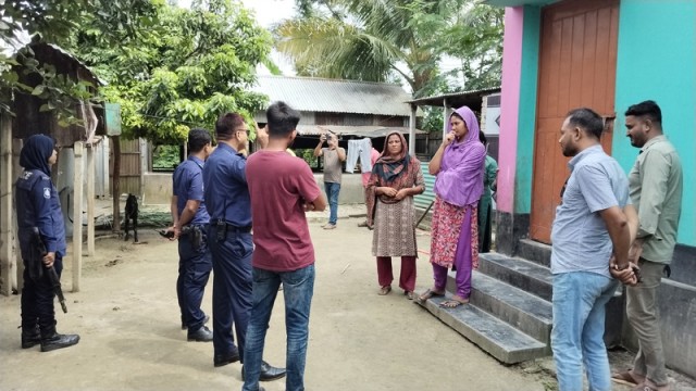 Police inspect the house of a Malaysian expatriate in Daspara village, Pabna Sadar, following an alleged attack by Jubo Dal activists on Thursday morning.