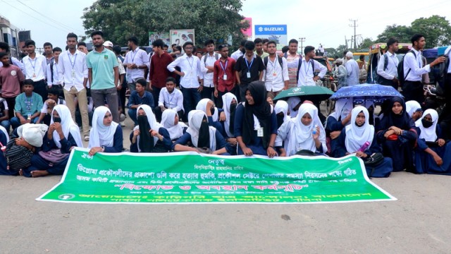 Students of Pabna Polytechnic Institute hold a protest march and block the highway in a sit-in demonstration. Photo taken Wednesday morning.