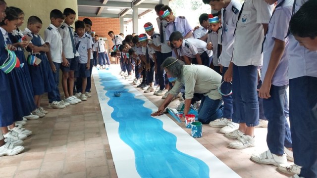 Students take part in a rally followed by a river-themed graffiti competition in Chatmohar, Pabna, on Saturday morning to mark World Rivers Day 2025.