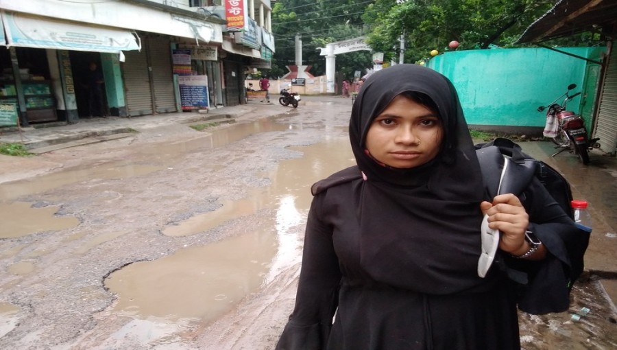 Rupa Khatun, 25, from Narail, breaks down in tears as she recounts her memories and search for her missing father, Nur Islam Molla, in Chatmohar.