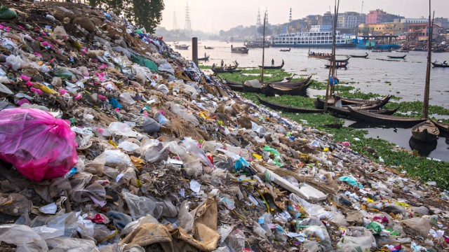Plastic waste and industrial pollution choke the Buriganga River in Dhaka, reflecting the environmental toll of unchecked urbanization and inadequate waste management.