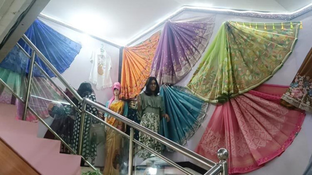 Local traders prepare for a busy season as shoppers flock to silk showrooms ahead of Eid-ul-Fitr.