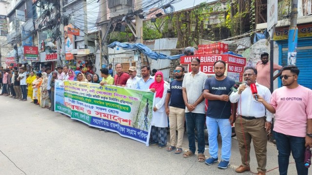 Participants form a human chain and gather for a rally at Saheb Bazar Zero Point in Rajshahi to observe World Rivers Day, highlighting the need to protect rivers and water resources.
