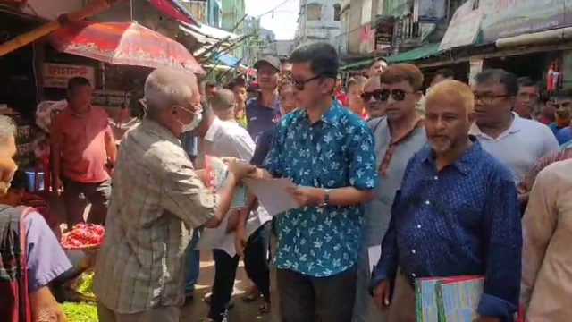 Advocate Dipen Dewan, BNP's Religious Affairs Secretary, leading a leaflet distribution campaign in Rangamati to promote the party's 31-point plan for building a new Bangladesh. (Photo: V7N)