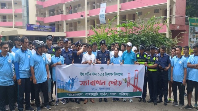 Participants join a colorful rally in Rangamati on Saturday as part of World Tourism Day 2025 celebrations.