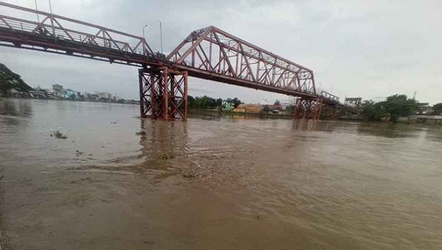 Residents of Sylhet observe the rapidly increasing water levels in the rivers, fueled by heavy rains in Cherrapunji, India. Fears of a third phase of flooding loom large as water continues to rise.